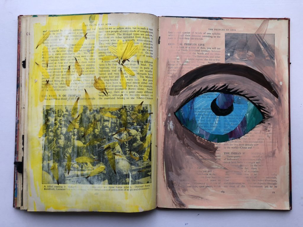 1 of 4. Cut through art journaling page of an eye and flower petals.