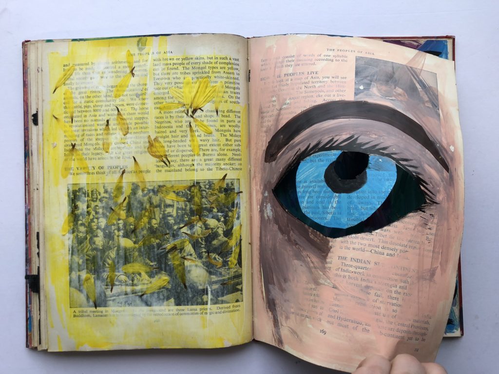 2 of 4. Cut through art journaling page of an eye and flower petals.