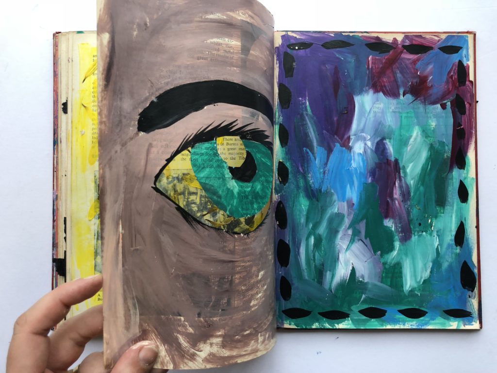 3 of 4. Cut through art journaling page of an eye and flower petals.
